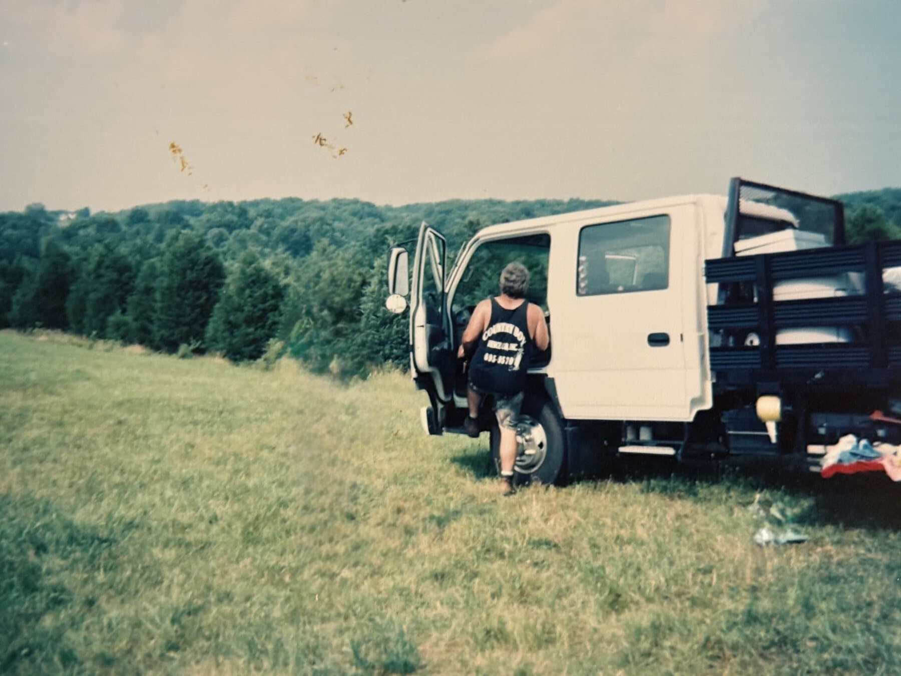 Joe Ledwick with an early Country Boy Fence work truck.